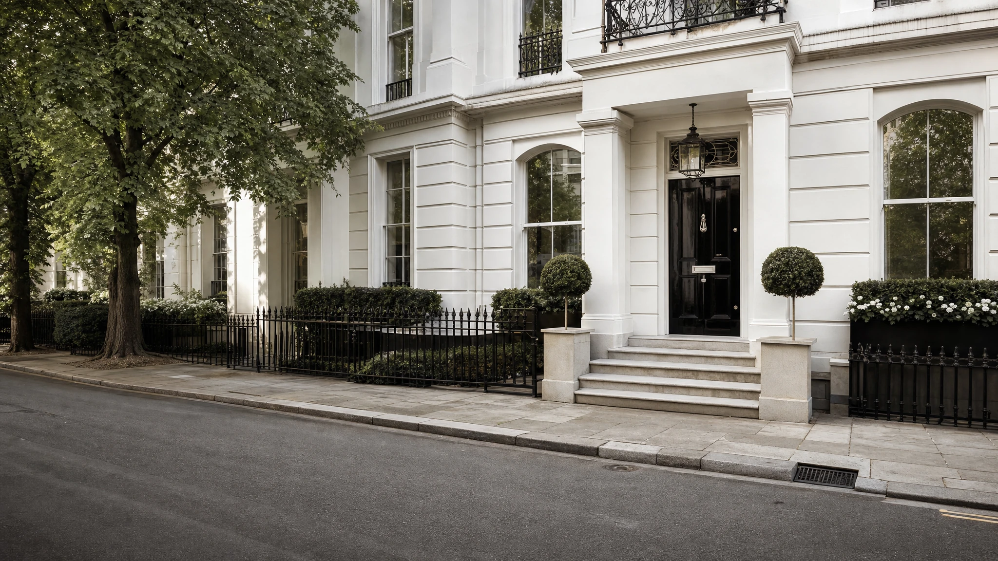A fine white stucco London townhouse in soft morning light